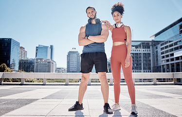 Image showing Black couple, outdoor training portrait and headphones for support, motivation and workout in city. Exercise, couple teamwork and goals for health, wellness and development with music by buildings