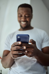 Image showing Smartphone, news and happy black man with loan application, credit score check or bank feedback and reading email on mobile app. Smile, communication and african man at home using phone or cellphone