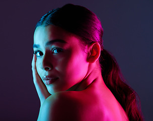 Image showing Beauty, neon shadow light and portrait of woman with dark lighting, facial cosmetics and skincare glow. Luxury studio makeup, aesthetic creativity and face model with creative pink blue color design