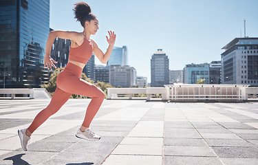 Image showing Fitness, city and woman running for exercise, health and wellness. Sports runner, energy and female athlete exercising, cardio or training workout outdoors on street for race, marathon or endurance.