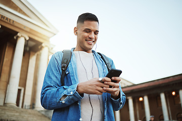 Image showing Happy man, earphones or phone on university, school or college campus on social media, education podcast or learning music. Smile, mobile technology or student listening to motivation radio on 5g app