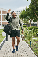 Image showing Fitness, happy or black man walking to gym and wave for training, exercise or workout with a duffle bag in Miami, Florida. Smile, traveling or healthy sports athlete with goals, motivation or pride