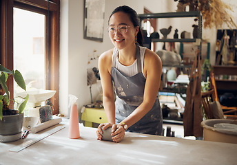 Image showing Asian, woman and artist in clay studio, workshop and creative startup to sculpture product. Ceramic designer, creative pottery process and production, manufacturing and creativity in small business