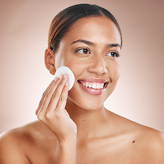 Image showing Cotton pad, skincare and woman with face beauty, facial treatment wellness and happy cleaning with skincare mockup. Skin, natural cosmetics and makeup removal, cosmetic care against studio background