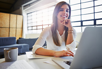 Image showing Portrait, laptop and business woman in office writing email in workplace. Face, computer and happy young female employee typing report, working on marketing project or advertising proposal in company