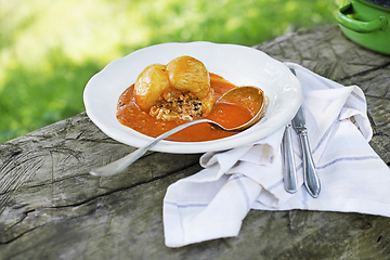 Image showing Stuffed peppers in tomato sauce