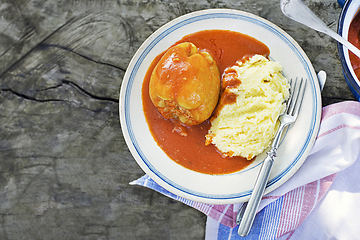 Image showing Stuffed peppers in tomato sauce