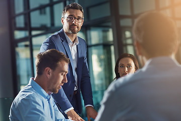 Image showing Business people, man and portrait at meeting in office, planning or strategy for teamwork, vision and leader. Businessman, leadership and team at desk with woman, collaboration and team building