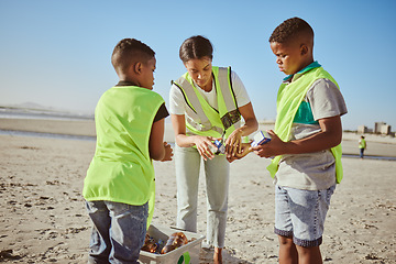 Image showing Plastic, beach volunteering and woman with children recycling, cleaning and learning, education or community for pollution. Family, mother and kids recycle with teamwork, project goals and earth day