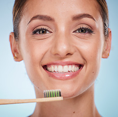 Image showing Brushing teeth, dental and woman with toothbrush for teeth whitening and beauty, oral health and fresh breath with studio background. Mouth wellness, Invisalign portrait and clean with bamboo brush.