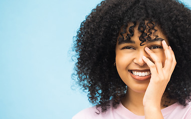 Image showing Smile, hands and portrait of black woman on blue background with makeup, cosmetics and fashion mockup. Beauty, advertising and happy face of girl with copy space for sale, promotion and discount