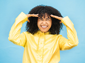 Image showing Face, thinking and laugh with a black woman on a blue background in studio for fun or laughter. Idea, joy and humor with an attractive young afro female laughing on a color wall for enjoyment