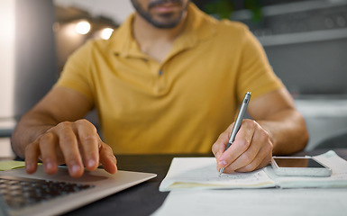 Image showing Businessman, hands and writing with pen by laptop for accounting, finance or planning schedule at home. Hand of male, person or remote employee busy with paperwork, diary or book for financial plan