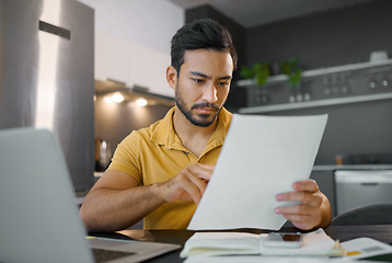 Image showing Budget, paperwork and Asian man planning with a laptop for finance, insurance and tax. Payment, note and Japanese entrepreneur reading information on a contract to start a small business from home