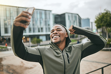 Image showing Fitness, phone selfie and black man in city taking picture for social media or happy memory outdoors in winter. Sports, training or male with 5g smartphone taking a photo showing arm muscle on street