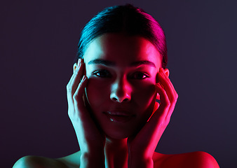 Image showing Beauty, neon shadow light and portrait of woman with dark lighting, facial cosmetics and skincare glow. Luxury studio makeup, aesthetic creativity and face model with creative pink blue color design