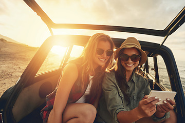 Image showing Women friends, selfie and car on vacation, beach and sunset on social media app with smile by waves. Woman, smartphone and outdoor in suv, ocean holiday or road trip for summer sunshine on internet