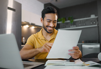 Image showing Planning, smile and Asian man with paperwork and a laptop for finance budget, entrepreneurship and tax. Happy, summary and freelancer reading the proposal of a project, financial deal or report