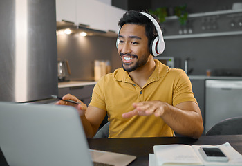 Image showing Happy man, headphones and video conference on laptop in home office while online, talking and on webinar. Entrepreneur person at desk working remote with virtual communication for freelance work