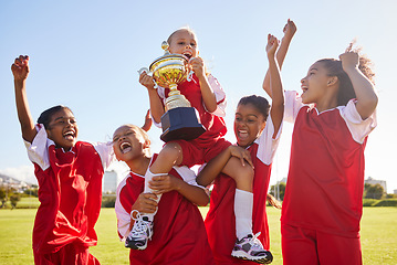 Image showing Soccer, team and trophy with children in celebration together as a girl winner group for a sports competition. Football, teamwork and award with soccer player kids celebrating success in sport