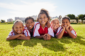 Image showing Soccer children team, portrait or happy for success, goal or wellness in match, game or competition with smile on field floor. Motivation, sport or kids in training, workout for teamwork exercise