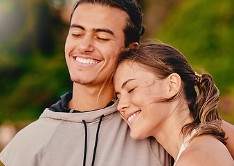 Image showing Happy couple, smile and hug embracing relationship and spending quality time together in the outdoors. Man and woman relaxing and smiling for holiday break, fresh air and satisfaction in nature