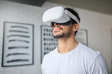 Image showing Virtual reality glasses, technology and man in home with headset for streaming interactive, online and 3d games. Futuristic, digital tech and male relax with vr for metaverse, cyberspace and gaming