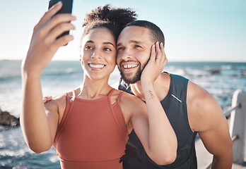 Image showing Black couple, fitness and happy selfie on beach for social media, sports exercise and support motivation. Athlete woman, man and happiness together for smartphone photography by ocean sea outdoor