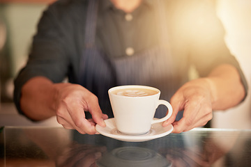 Image showing Coffee, cafe and hands of waiter with cup on table in restaurant. Small business, cappuccino art or barista, man or server holding fresh, delicious or hot mug of caffeine or espresso in shop or store