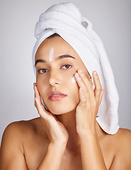 Image showing Woman, skin cream and face portrait with facial moisturizer and spa beauty in morning. Towel, sunscreen and wellness care of a young person with cosmetic, collagen and detox dermatology product