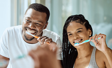 Image showing Black couple, toothbrush and dental wellness in bathroom together for grooming, beauty hygiene and healthcare. African man, woman and happy oral care or brushing teeth for healthy morning routine