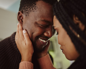 Image showing Black couple, face and love while together at home with care and happiness in a healthy marriage with commitment. Young man and woman intimate while in the kitchen to bond in their house or apartment