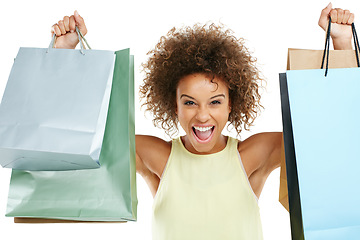 Image showing Shopping, retail and black woman customer excited with sale or deal isolated against a studio white background. Portrait of happy, fashion and joyful winner celebrating holding bags at a giveaway