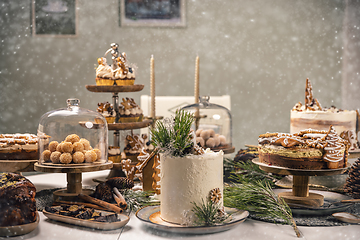 Image showing Fancy sweets table with variety of Christmas desserts,