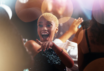 Image showing Dance, night and disco with black woman at party for club, celebration and energy. Concert, music and rave with girl dancing in crowd for new year, freedom and entertainment at dj festival event