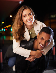 Image showing Couple of friends, piggyback and night portrait on city street or road in birthday celebration, romance date and goofy game. Smile, happy and man carrying woman in comic activity and silly bonding