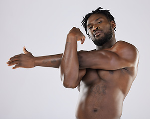 Image showing Black man, fitness and stretching portrait with sports person in studio for strong body and muscle. Health and wellness of a male bodybuilder model with goals for exercise, workout and training