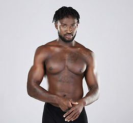 Image showing Fitness, black man and body portrait of sports person in studio for strong muscle and power. Health and wellness of a sexy male bodybuilder model with growth after exercise, workout and training