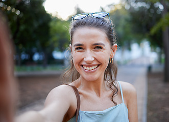 Image showing Selfie, young woman and casual in park, walking and smile for fun, balance and happiness. Portrait, female and lady with joy, summer and chilling outdoor, cheerful and freedom on break and weekend
