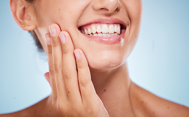 Image showing Beauty, teeth and face with woman and hand for manicure, nail care and cosmetics facial, Invisalign and skincare against studio background. Healthy skin, wellness and dermatology with teeth whitening