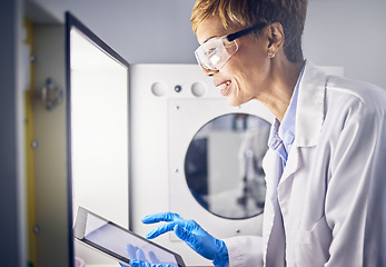 Image showing Senior woman, scientist and tablet in lab for research, science innovation with digital results and scientific study. Incubator, experiment and biotechnology with technology, safety goggles and smile