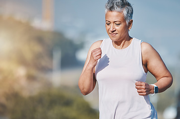 Image showing Senior woman, fitness running and outdoor exercise for sports wellness, healthy body workout and cardio training. Elderly athlete, focus and runner freedom and marathon lifestyle in nature park