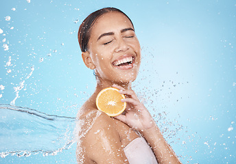 Image showing Water, lemon and woman with happy skincare, beauty or cosmetics product in studio or shower mockup for vegan advertising. Wellness model with fruit in hands and splash for healthy dermatology glow