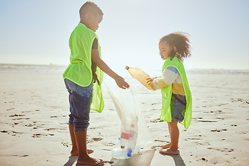 Image showing Children, plastic bottles or beach clean up in climate change, environment sustainability or planet earth recycling. Boy, girl or students in cleaning sea, ocean waste management or community service