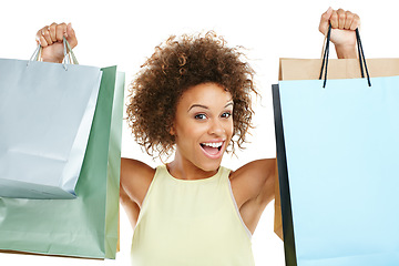 Image showing Portrait, shopping and retail with a black woman in studio isolated on a white background while holding shopping bags. Store, customer and discount with a female model on black space for marketing