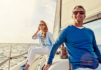 Image showing Mature couple, people or sailing yacht bonding on ocean, sea or water in relax holiday, vacation or summer adventure. Smile, happy man or woman on luxury boat in retirement travel location or freedom