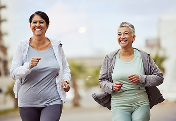 Image showing Fitness, city or senior friends running in a marathon challenge with sports performance goals on urban city street. Happy, runners or healthy mature women in cardio workout, training or body exercise