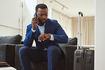 Image showing African businessman, checking time in hotel and phonecall for work travel schedule in Atlanta. Young black entrepreneur speaking on cellphone, professional time management or luxury airport travel