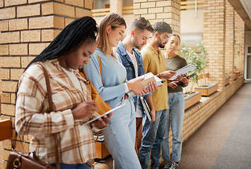 Image showing University, lobby and diversity, group of students standing in row together with books and tablet before class. Friends, education and future, studying in college corridor for exam at business school