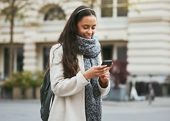 Image showing Travel, walking and woman with phone in city in street, road and sidewalk in for urban adventure in London. Social media, freedom and girl using mobile app, digital map and internet on smartphone